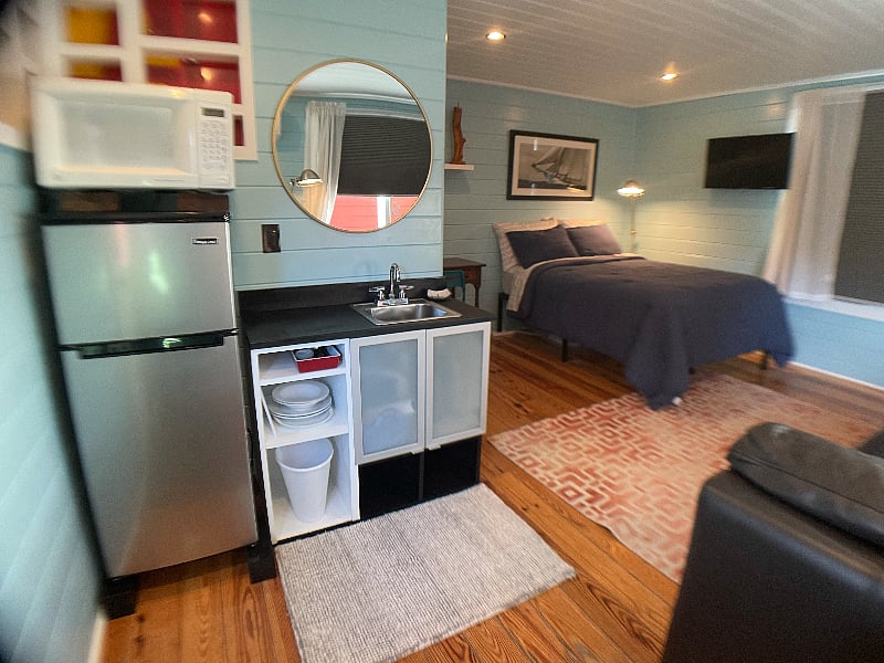Kitchenette - dishes, utensils are tucked away. Appliances out of view: coffee pot, electric hot water kettle, convection/toaster oven, crock pot, electric burner, pots and pans.