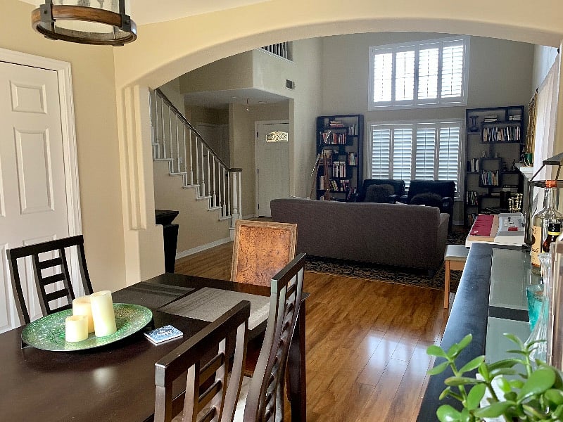 View toward front door from the Dining Room into the Living Room.  Door to the left is to the kitchen.