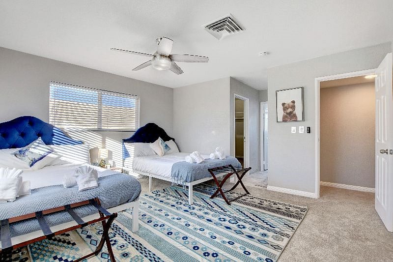 Bedroom #5 upstairs: 2 Queens,  ensuite bathroom, TV, and spacious walk in closet 