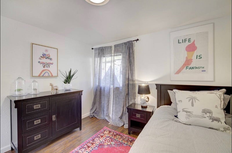 Bedroom with a queen size bed and perfect amount of storage!