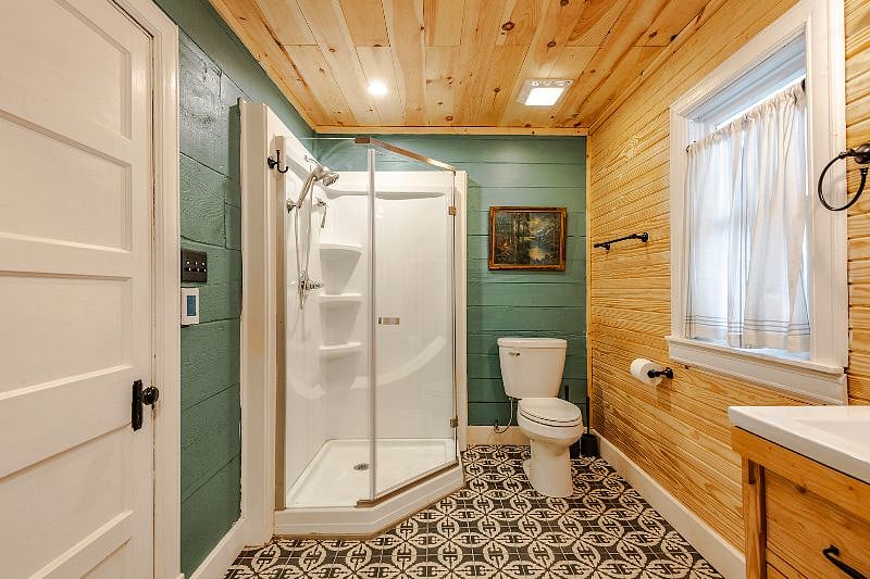 The spacious bathroom space has a heated floor and a thermostat! Perfect for warming your feet after a long shower or chilly morning.