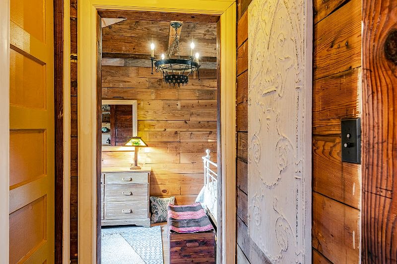 A hallway connects the kitchen to the bedroom. A walk-in storage closet is accessible from this space for some great storage during your stay.