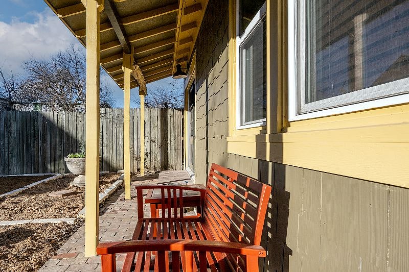 Spend some time on the covered porch! The cottage has its own porch space complete with a bench and side table for your laptop, books, or a coffee on a beautiful morning.