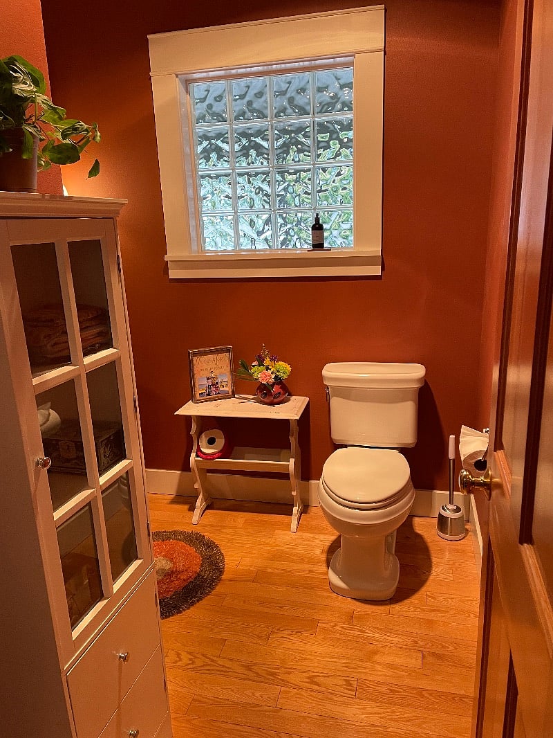 Powder room in hall near kitchen.