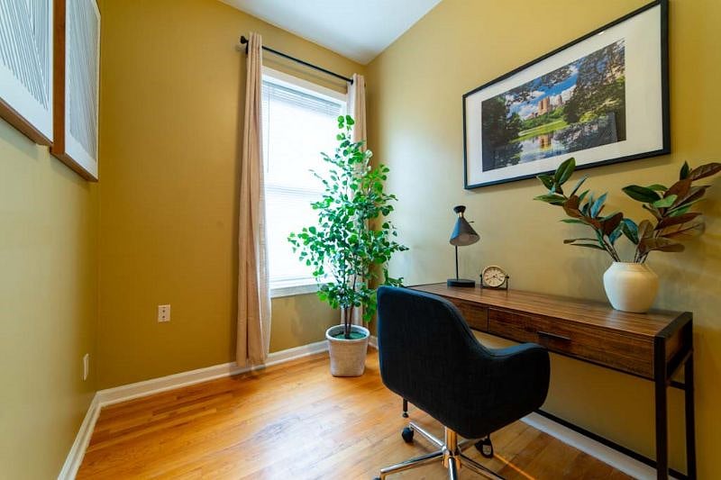 Office space and study room with unique lamp that charges all types of phones no USB needed.