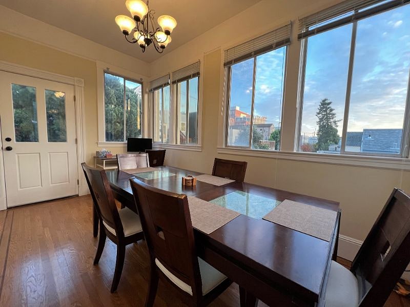 Dining room with lots of light and nice views. This large table can be set smaller.
