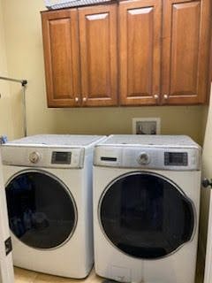 DEDICATED LAUNDRY ROOM WITH WASHER, DRYER AND FOLD DOWN IRONING BOARD