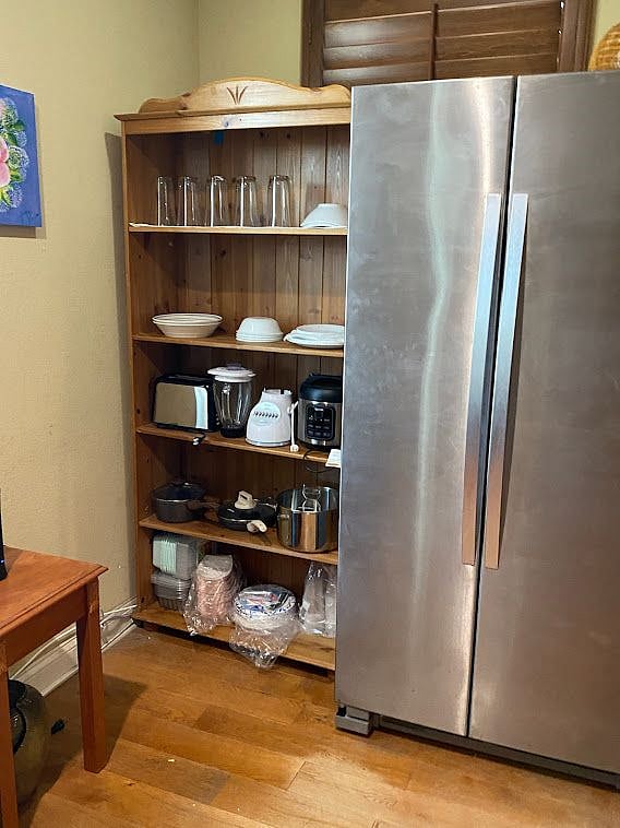 Full sized refrigerator/freezer with cookware in the common room upstairs.
