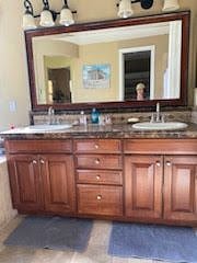 TWIN VANITIES IN THE MASTER BEDROOM BATHROOM