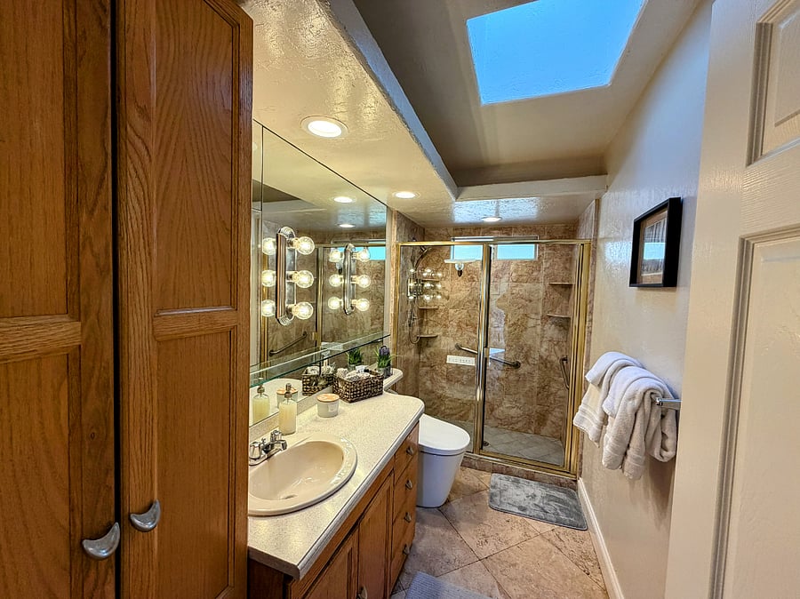 Bathroom with bidet toilet and walk-in shower