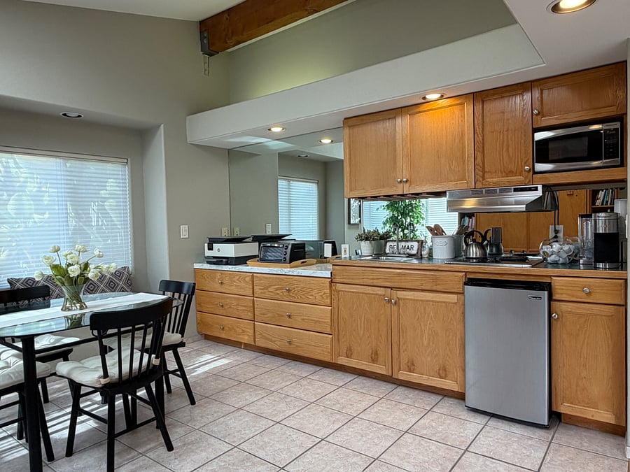 Kitchenette in primary bedroom with mini fridge, microwave and 2 stove top burners.