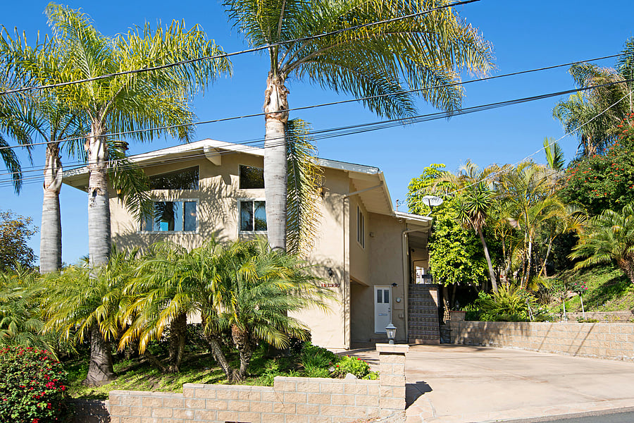 Exterior of the house - entry to the downstairs unit is through the white door to the left of the stairs.