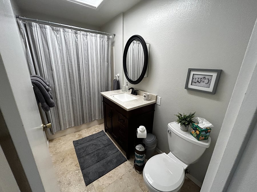Private bathroom with tub and shower.