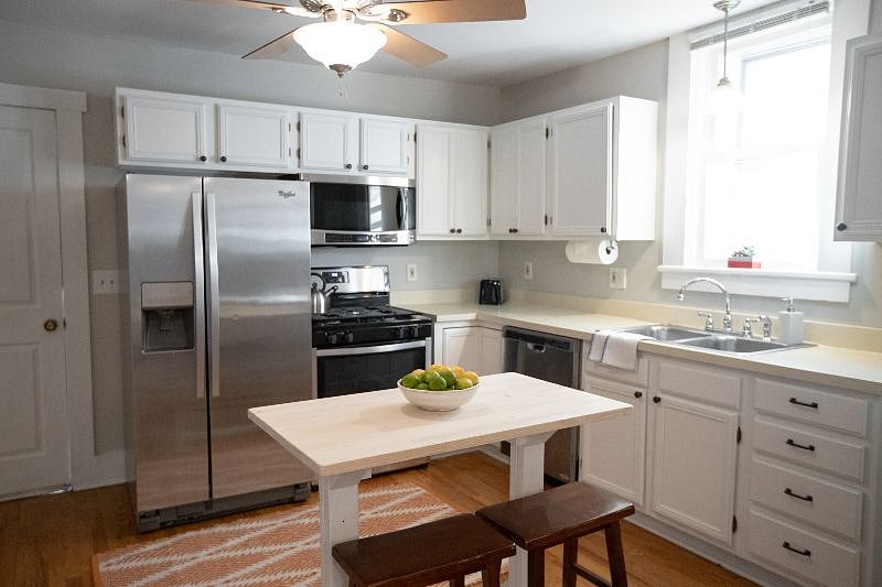 Eating table and stools in kitchen.