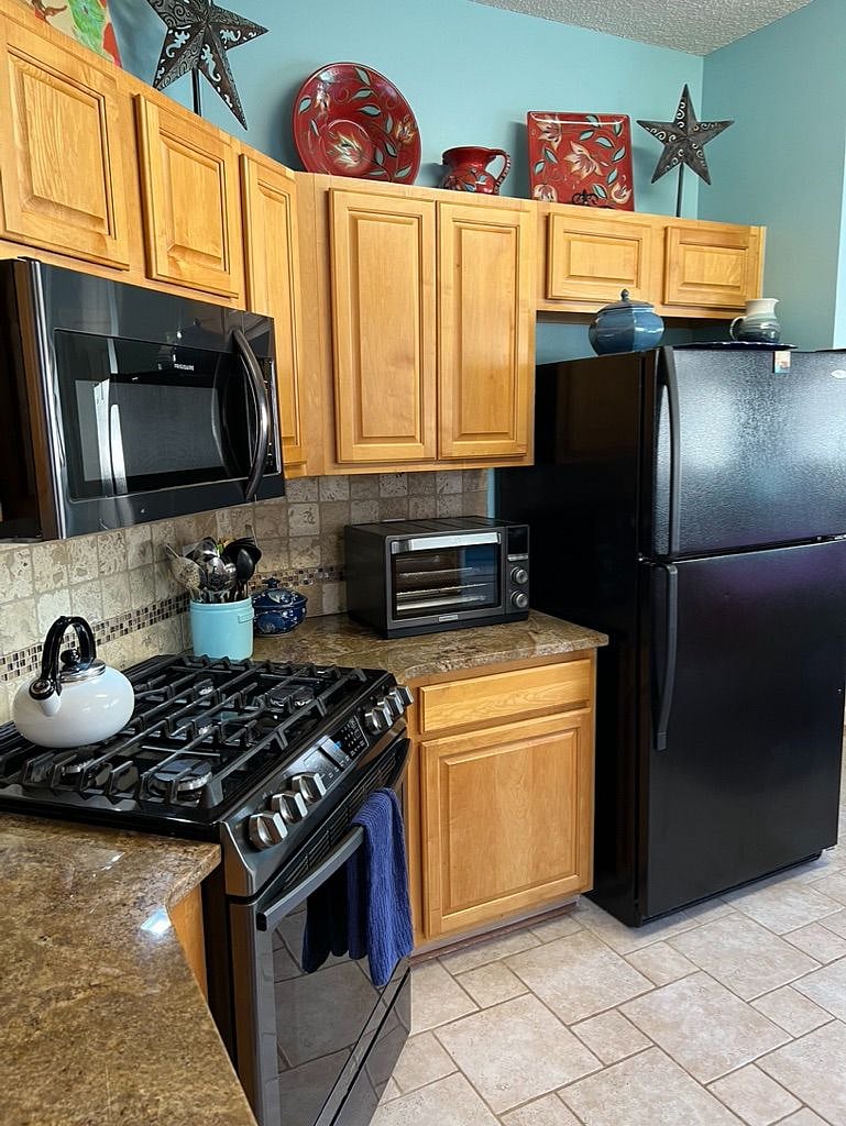 Gas range, microwave and toaster oven included.
