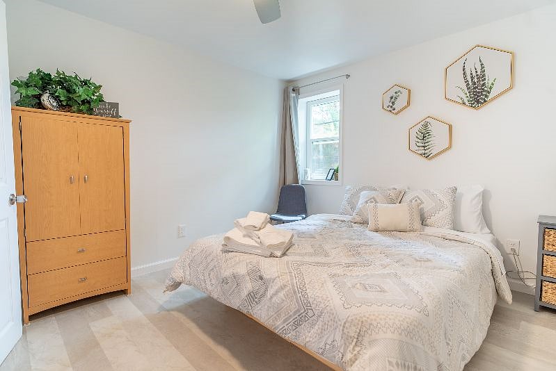 Both bedrooms have a comfy queen foam mattress, two bedside tables with reading lamps, a dresser/wardrobe and a closet for your clothes. A ceiling fan with adjustable speed and brightness, as well as room-darkening curtains and white noise machine should help you sleep easy, even during the day.