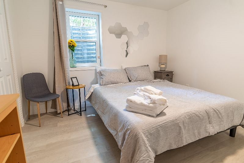 Both bedrooms have a comfy queen foam mattress, two bedside tables with reading lamps, a dresser/wardrobe and a closet for your clothes. A ceiling fan with adjustable speed and brightness, as well as room-darkening curtains and white noise machine should help you sleep easy, even during the day.