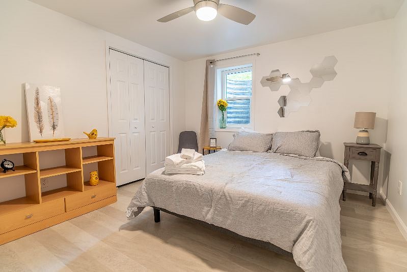 Both bedrooms have a comfy queen foam mattress, two bedside tables with reading lamps, a dresser/wardrobe and a closet for your clothes. A ceiling fan with adjustable speed and brightness, as well as room-darkening curtains and white noise machine should help you sleep easy, even during the day.