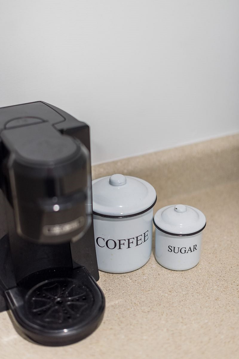 Thanks to a connection with our local Starbucks, fresh ground Starbucks coffee (and sugar) is included for all our guests. The Keurig machine makes one cup at a time to reduce waste with full-pot brewing systems.