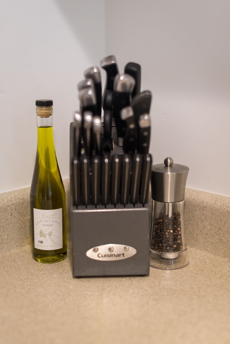 You'll find all the basic necessities in our kitchen. Olive oil, salt and pepper are included, as well as cutlery, silverware, pots, pans, pot-holders, cooking utensils, baking dishes, baking sheets, microwave, crockpot, rice-cooker and a cutting board!