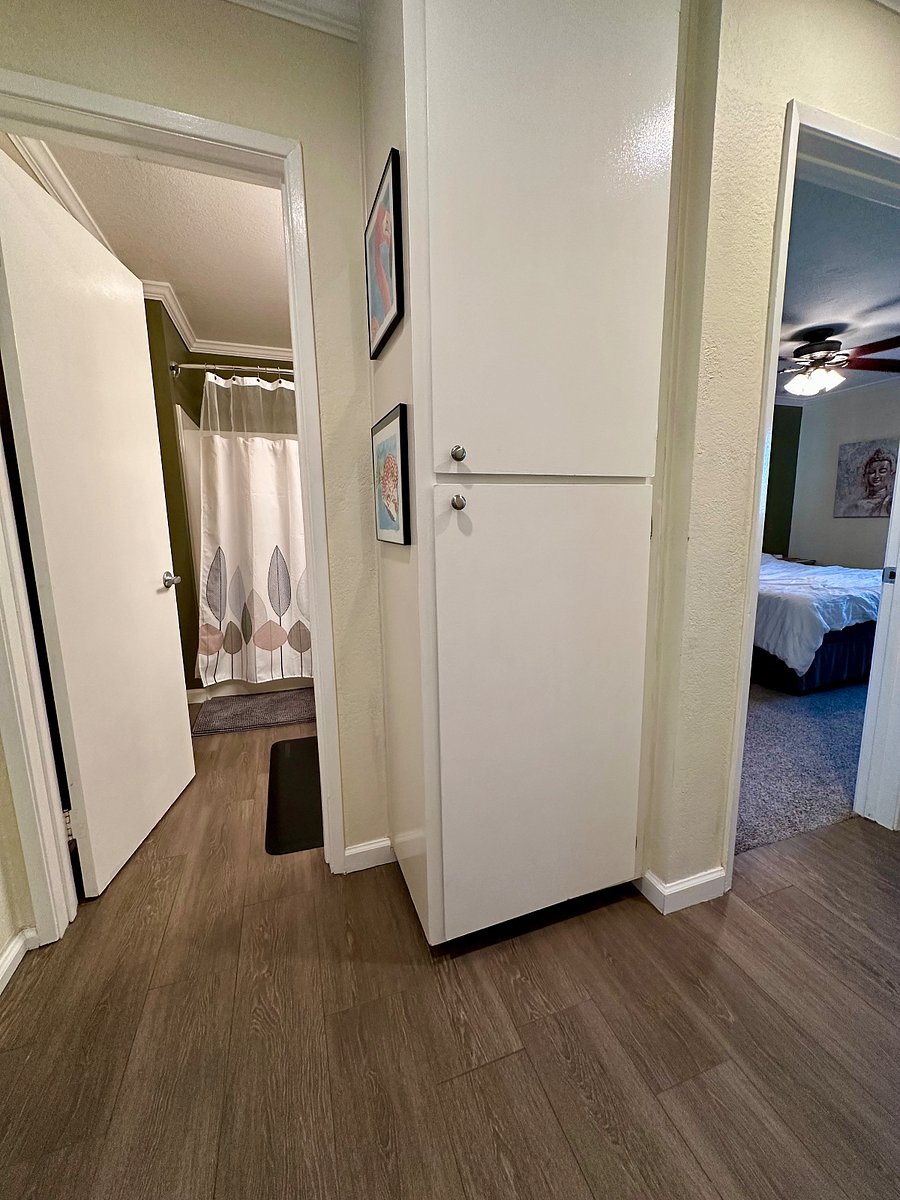 Hall closet with extra storage space.