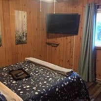 Bedroom #1 with Roku TV, full bed, and ceiling fan, room darkening drapes
