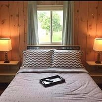 Bedroom #2 With Roku TV, ceiling fan, full bed and room darkening drapes