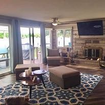 Our large living room with Roku TV, room darkening drapes and bottom up top down shades.