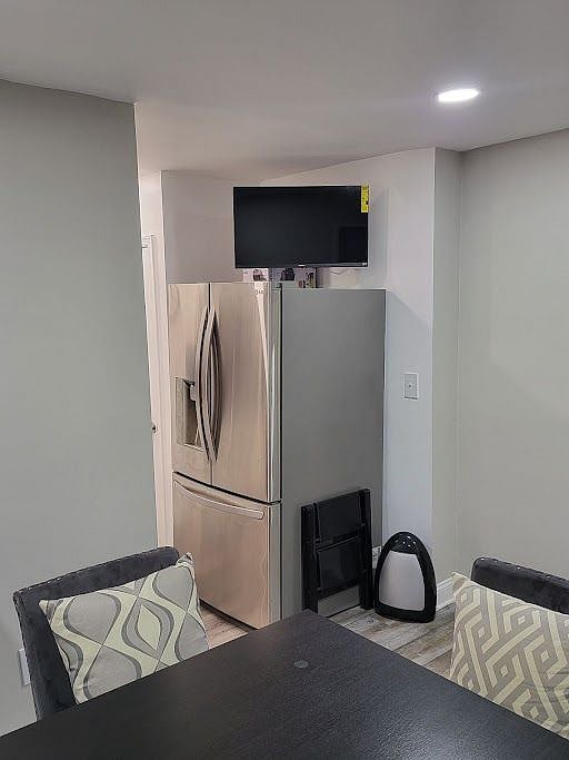 Watch the TV from the kitchen or dining room