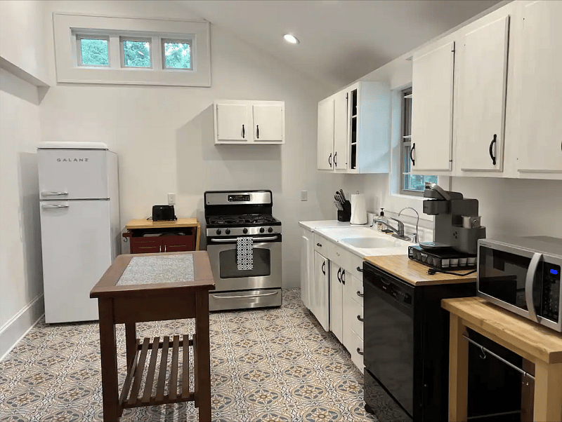 Spacious kitchen is stocked with all of the basics you need to prepare meals.