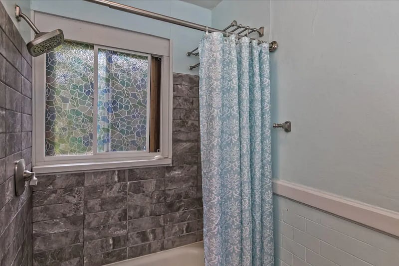 Hall bathroom with a shower/tub combo