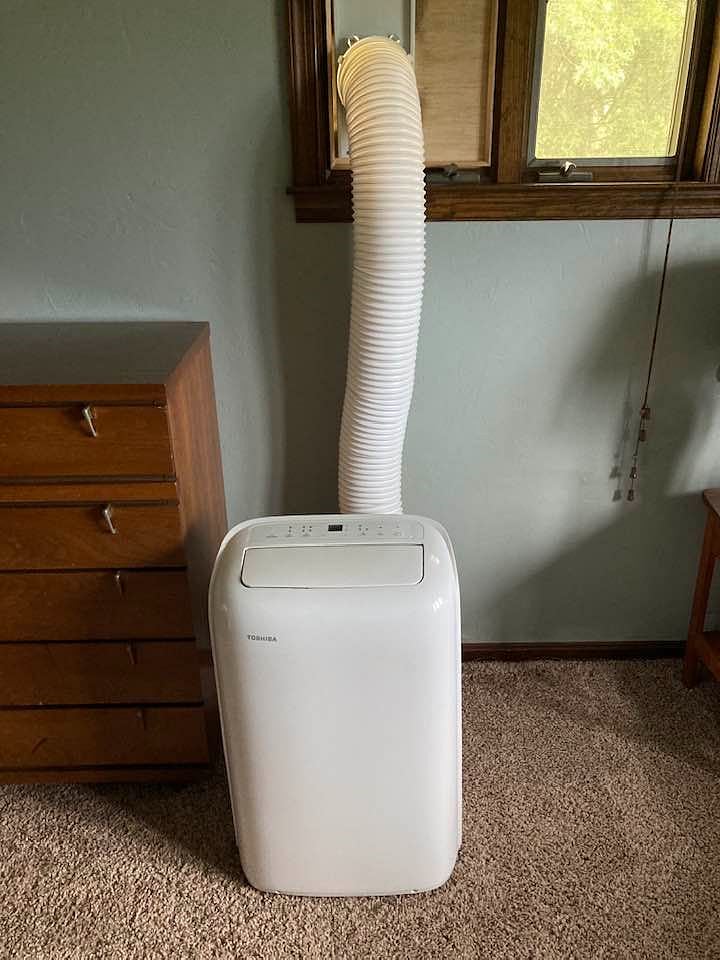 House has central air conditioning, but just incase you need it colder, in the summer months there is a window air conditioner present.