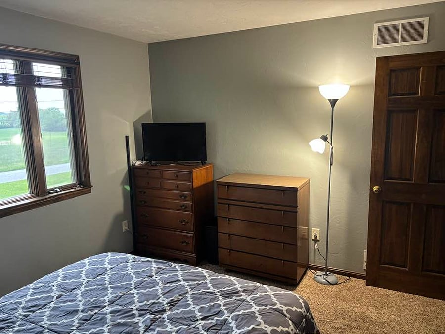 Room in question. Queen bed (bedding provided), two dressers, nightstand, smart TV, and lamp currently provided. Further amenities pending. Closet is roughly 6' wide x 20" deep
