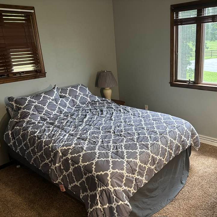 Room in question. Queen bed (bedding provided), two dressers, nightstand, smart TV, and lamp currently provided. Further amenities pending. Closet is roughly 6' wide x 20" deep