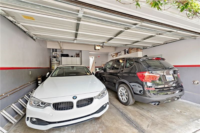 Two car garage with a couple of leftover items in storage