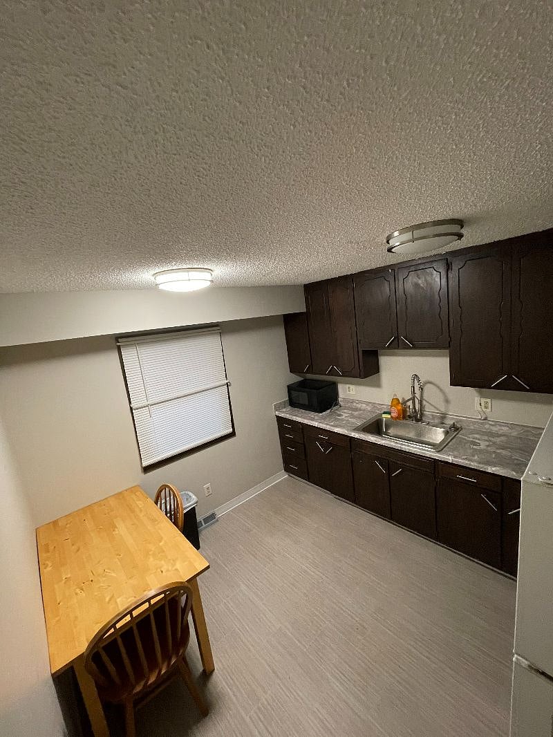 1213 Kitchen - Brand New Countertops, Farmhouse Sink, and flooring.