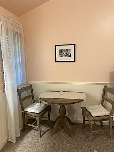 Lovely eat in area for two, next to a window.