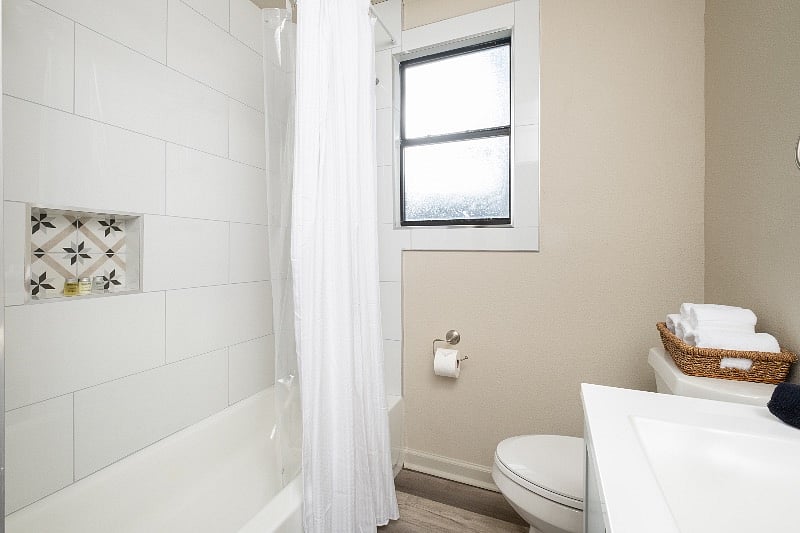 Tile surround in bath.