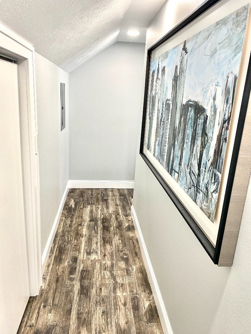Bright hallway with modern art and decor that separates each bedroom