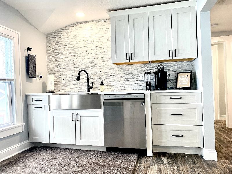 Modern kitchen with stainless steel appliances and a convenient coffee station