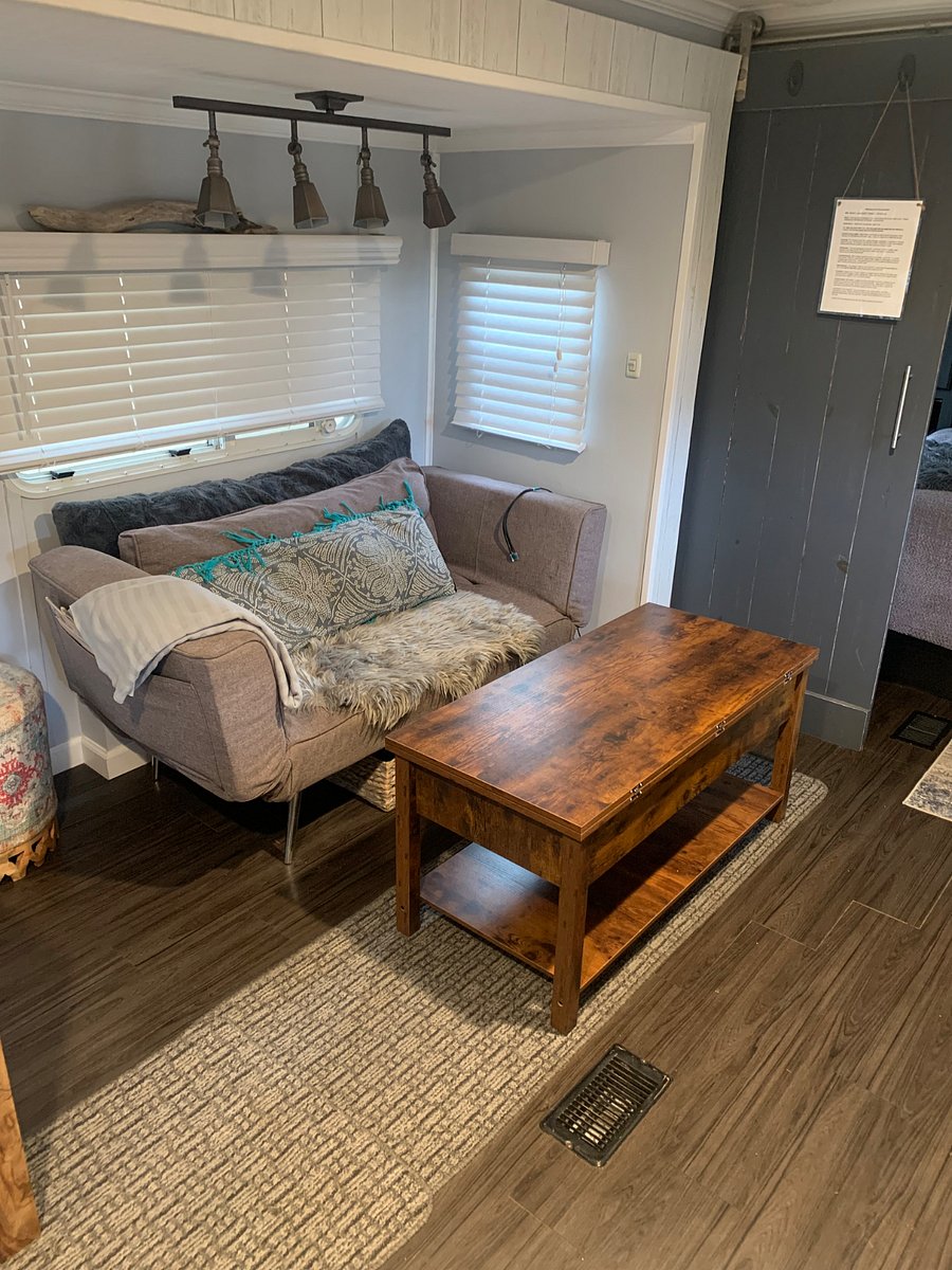 Coffee table converts to desk/storage work space.