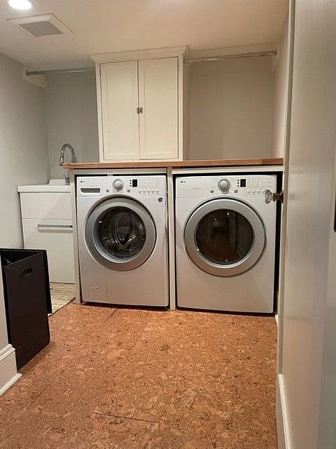 Large laundry room  with storage, hanging and utility sink