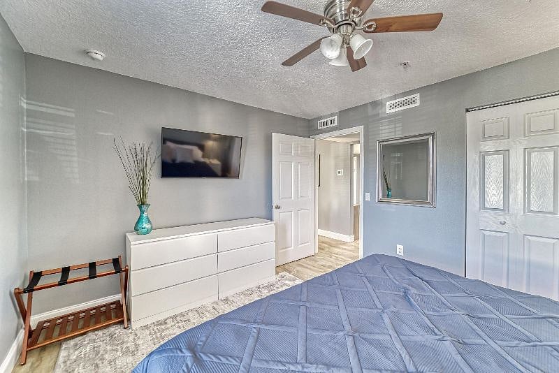 King Bed with Closet, Dresser and TV