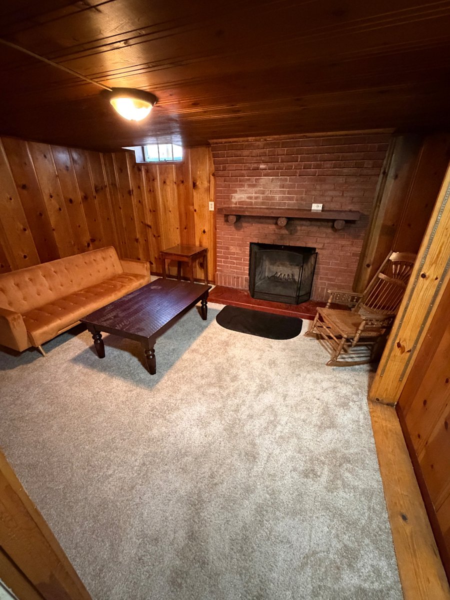 Lounging room in basement with second fireplace