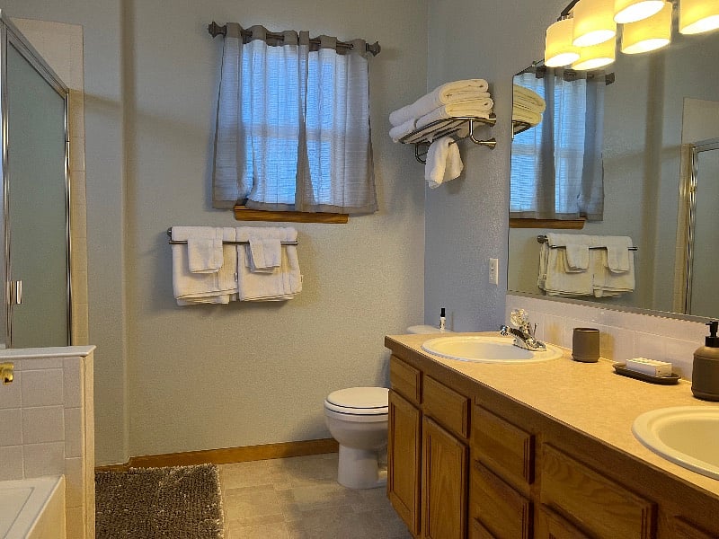Master Bathroom. Walk in shower and separate bathtub. All the towels you will need provided.
