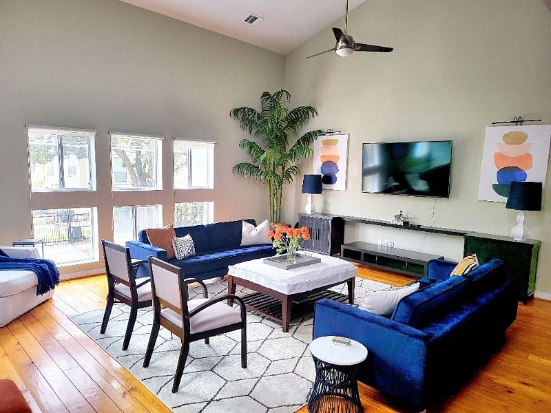 Large, double height living room with bold modern decor