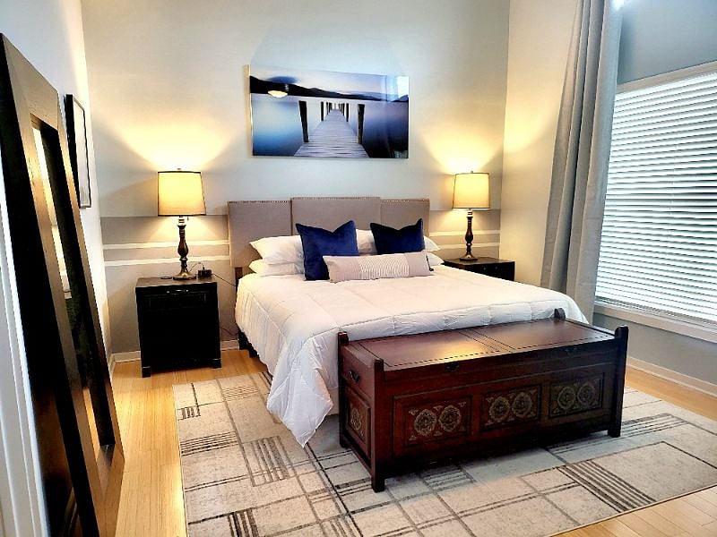 Top floor master suite features high vaulted ceiling   