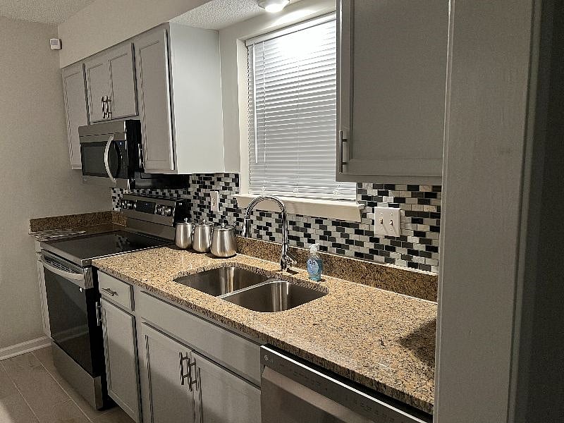 Full kitchen including stainless steel appliances. Kitchen cooking supplies for your home cooking.