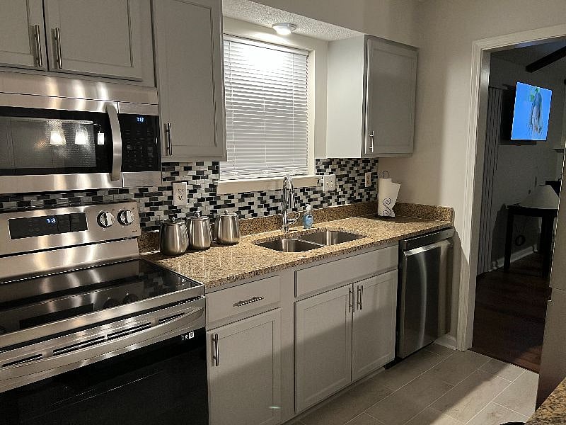 Comfortable kitchen with stainless steel appliances