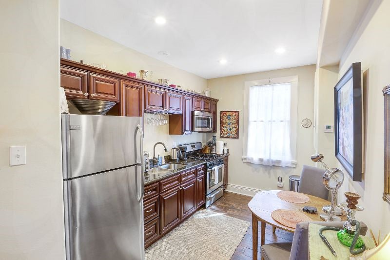 Fully stocked kitchen with full sized fridge, microwave, gas stove, oven and toaster oven